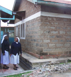 Sr. Christine and Sr. Lucy showing the outside of the new operating room